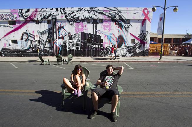 Sarah April and Jared Kash of Las Vegas hang out on 7th Street during the Life is Beautiful Festival in downtown Las Vegas Sunday, Oct. 27, 2012.