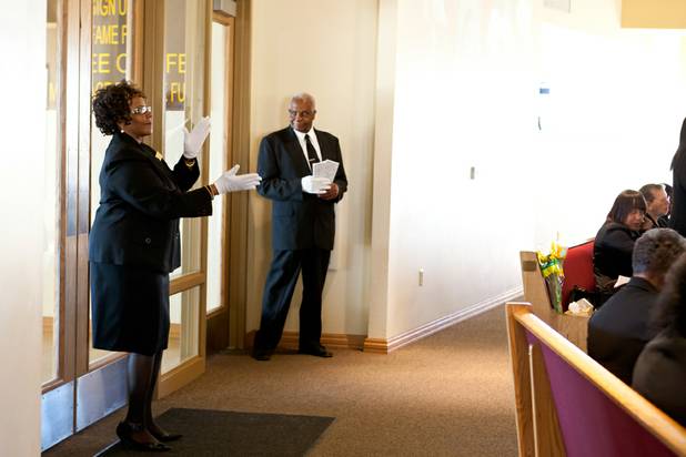 An usher dances at the back of the church while the choir sings during the morning service at the First African Methodist Episcopal Church in Las Vegas on Sunday, Oct. 27, 2013.