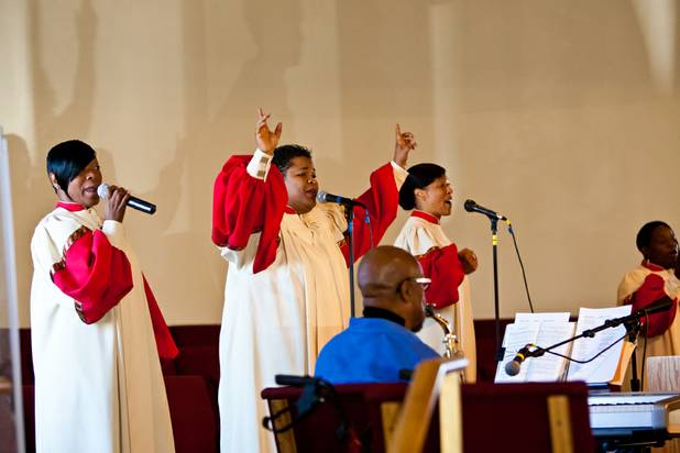Stephanie Liferidge, left, joins choir members in song at the beginning of the morning service at the First African Methodist Episcopal Church in Las Vegas on Sunday, Oct. 27, 2013.