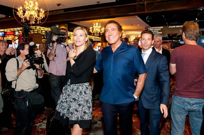 CEO Seth Schorr, right, gives Steve and Andrea Wynn a tour during the opening of the Downtown Grand Las Vegas on Sunday, Oct. 27, 2013.
