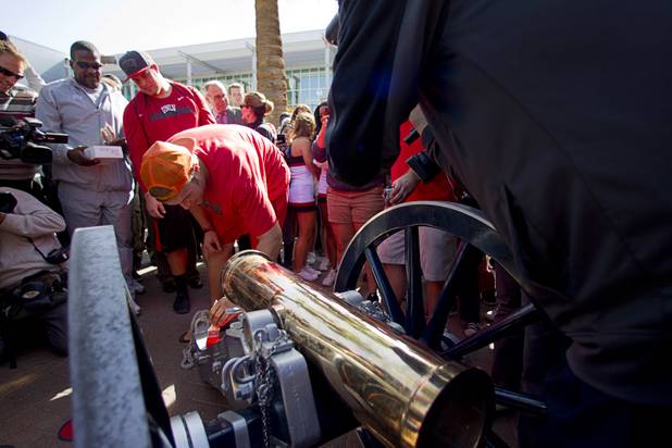 UNLV football players paint the Fremont cannon during a ceremony on UNLV campus Monday, Oct. 28, 2013. The UNLV football team beat Reno Saturday 27-22 to break an eight-year losing streak in the rivalry game and gain possession of the Fremont cannon.