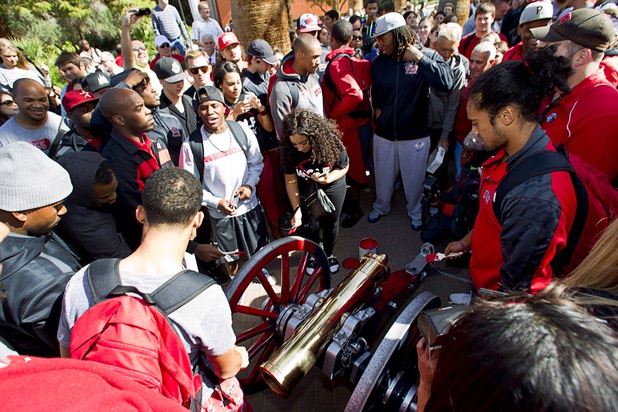 Football players and other students surround the Fremont cannon during painting ceremony on UNLV campus Monday, Oct. 28, 2013. The UNLV football team beat Reno Saturday 27-22 to break an eight-year losing streak in the rivalry game and gain possession of the Fremont cannon.