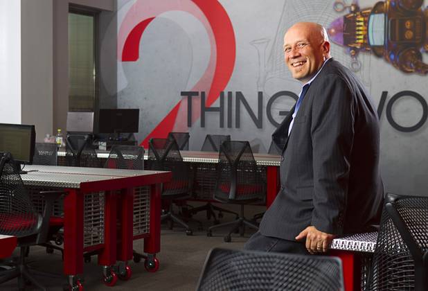 Ben Jones, vice president/director of sales for Jennifer Web Design, poses in the company's workspace in the Switch inNEVation Center Monday, Oct. 28, 2013.