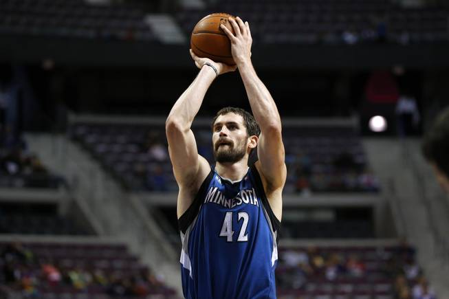 Minnesota Timberwolves forward Kevin Love shoots against the Detroit Pistons in the first half of their preseason NBA game in Auburn Hills, Mich., Thursday, Oct. 24, 2013.
