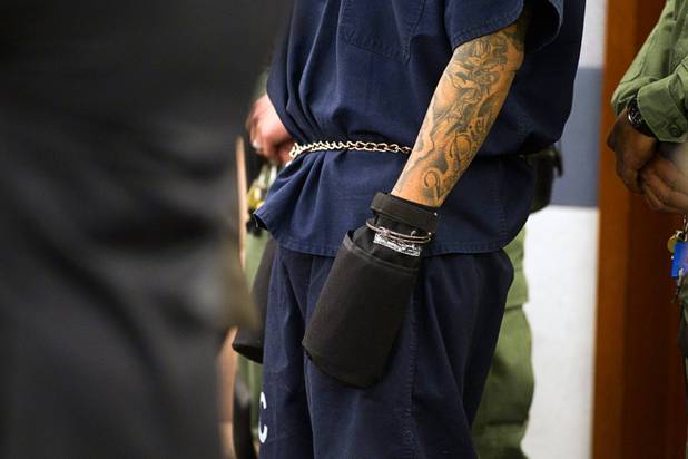 Ammar Harris, the suspect the Feb. 21 Las Vegas Strip shooting and car crash that killed three people, is shown wearing hand restraints as he appears in court at the Regional Justice Center Wednesday, Oct. 30, 2013.