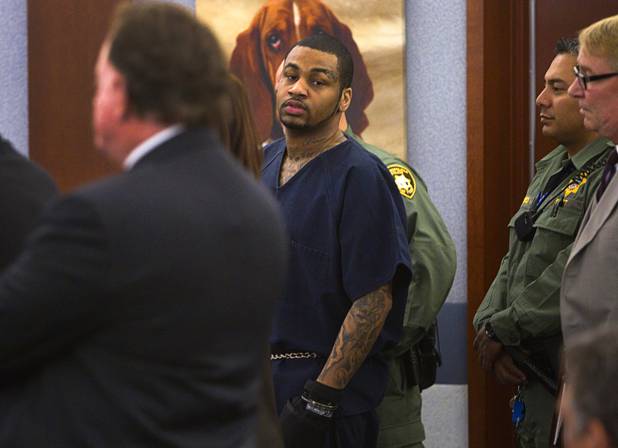 Ammar Harris, the suspect the Feb. 21 Las Vegas Strip shooting and car crash that killed three people, is shown wearing hand restraints as he appears in court at the Regional Justice Center Wednesday, Oct. 30, 2013.