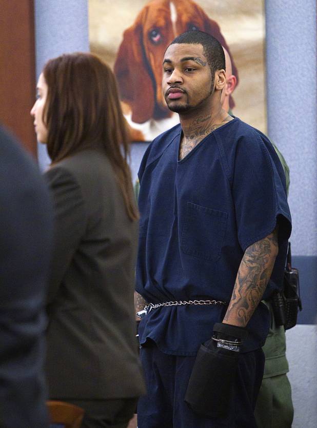 Ammar Harris, the suspect the Feb. 21 Las Vegas Strip shooting and car crash that killed three people, is shown wearing hand restraints as he appears in court at the Regional Justice Center Wednesday, Oct. 30, 2013.