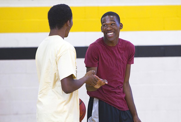 Diontae Jones, left, congratulates Jordan Turner after a dunk during intramurals at Clark High School Wednesday, Oct. 30, 2013.