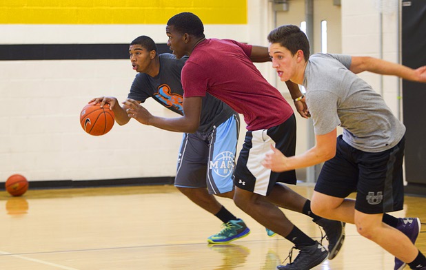 Sherron Wilson, left, Jordan Turner and Carter Olsen are shown during intramurals at Clark High School Wednesday, Oct. 30, 2013.