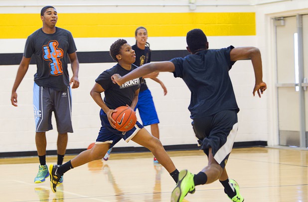 Keyshawn Webb, center, drives to the basket during intramurals at Clark High School Wednesday, Oct. 30, 2013.