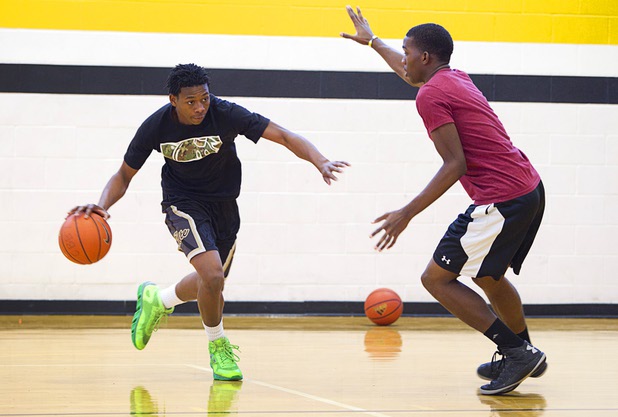 Darius Jackson, left, is covered by Jordan Turner during intramurals at Clark High School Wednesday, Oct. 30, 2013.