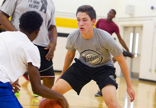 Carter Olsen, right, covers sophomore Leslie Long during intramurals at Clark High School Wednesday, Oct. 30, 2013.