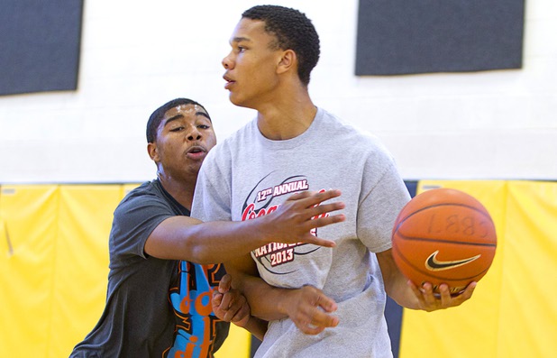 Sherron Wilson, left, covers his brother Deshawn Wilson during intramurals at Clark High School Wednesday, Oct. 30, 2013.
