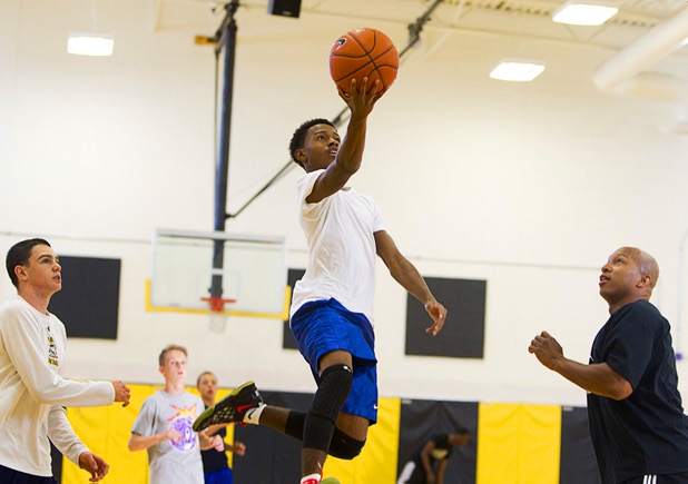 Sophomore Leslie Long, center, drives to the basket during intramurals at Clark High School Wednesday, Oct. 30, 2013.