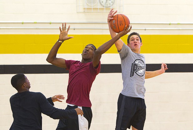 Jordan Turner, center, and Carter Olsen fight for a rebound during intramurals at Clark High School Wednesday, Oct. 30, 2013.