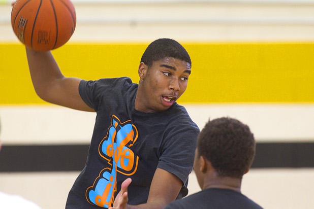 Sherron Wilson passes the ball during intramurals at Clark High School Wednesday, Oct. 30, 2013.