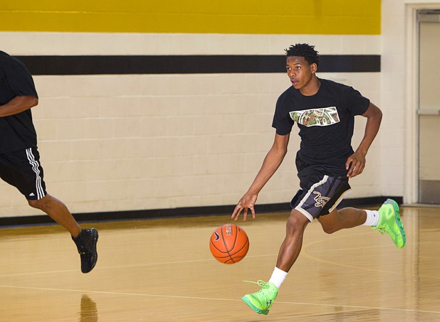 Darius Jackson takes the ball downcourt during intramurals at Clark High School Wednesday, Oct. 30, 2013.