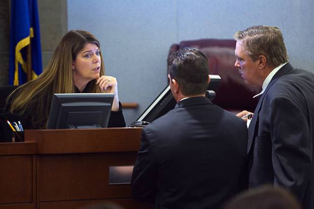 Judge Cynthia Cruz talks with Chief Deputy District Attorney Robert Daskas, left, and Bob Beckett, attorney for Benjamin Frazier, at the Regional Justice Center Wednesday, Oct. 30, 2013. Frazier is accused of shooting two security guards and a patron outside the Drai's after-hours club in Bally's on Oct. 21, 2013.