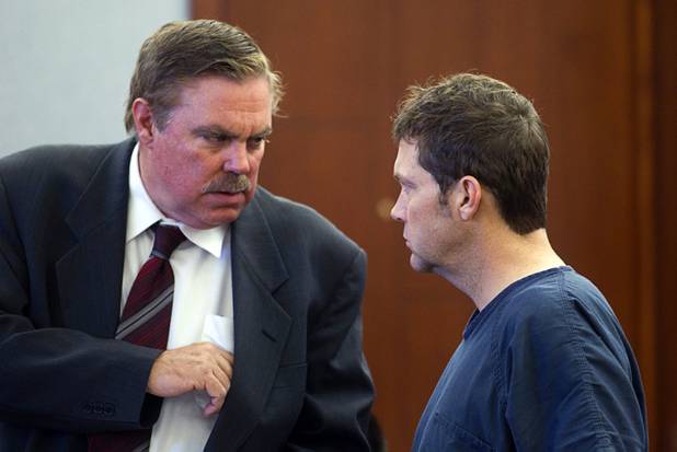 Attorney Bob Beckett, left, talks with Benjamin Frazier, 41, during a court appearance at the Regional Justice Center Wednesday, Oct. 30, 2013. Frazier is accused of shooting two security guards and a patron outside the Drai's after-hours club in Bally's on Oct. 21, 2013.