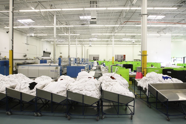 Freshly washed sheets are ready to be ironed and folded during a walk-through of Apex Linen in Las Vegas Tuesday, October 30, 2013.
