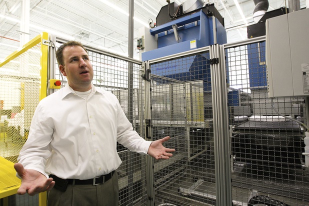 Executive Vice President Marty Martin discusses how his staff is on high alert, sorting through linens for hidden ink packets sewn in by an anonymous perpetrator, during a walk-through of Apex Linen in Las Vegas Tuesday, October 30, 2013.