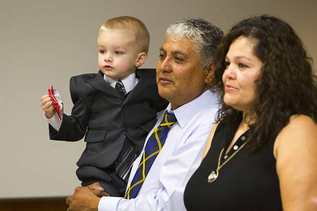 Gerardo Torres, 2, is adopted by Moses and Enedina Torres during a Halloween adoption day at Family Court Thursday, Oct. 31, 2013.