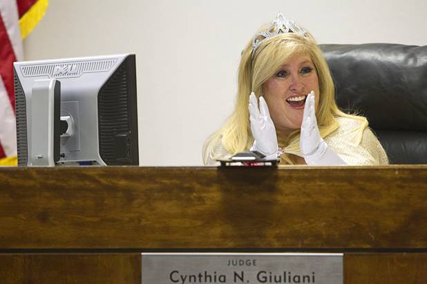 Judge Cynthia Giuliani, dressed as a fairy godmother, applauds during a Halloween adoption day at Family Court Thursday, Oct. 31, 2013. Giuliani dressed up last year on Halloween and got so much positive reaction that she decided to dress up again, she said.