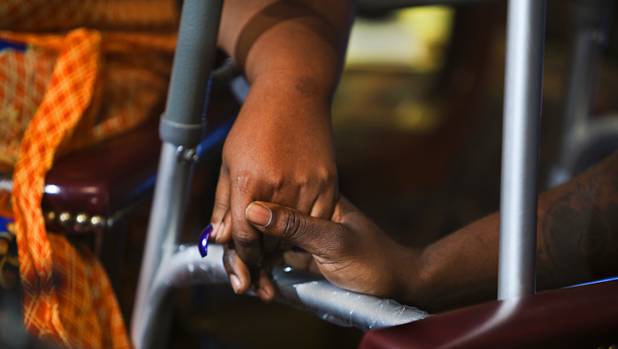 Antoine Hodges holds his wife Annette's hand as he speaks during a news conference at his attorney's office Friday, Nov. 1, 2013. Hodges was mistaken as homicide suspect and shot by a Metro Police officer Oct. 21, 2013.