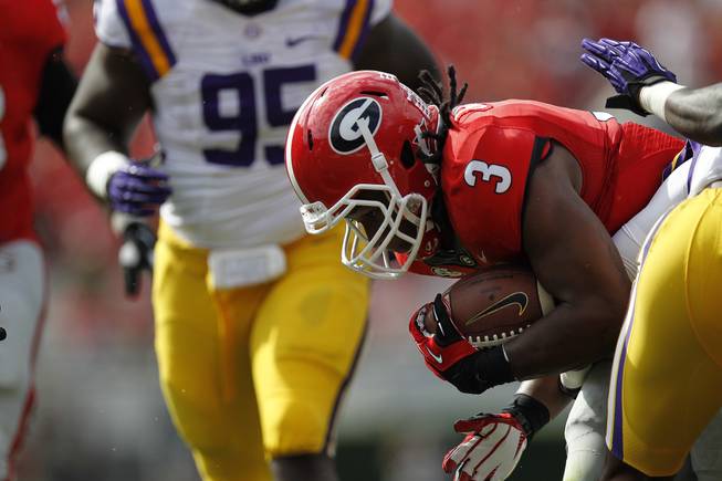 Georgia running back Todd Gurley (3) works against the LSU during the first half of an NCAA football game, Saturday, Sept. 28, 2013, in Athens, Ga.