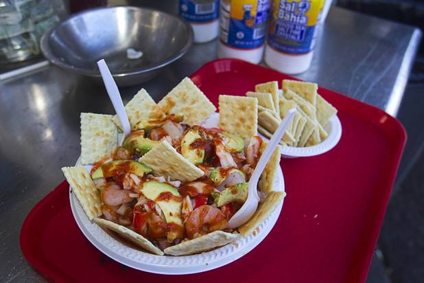 A seafood salad plate ($16.00) is shown in the Arreolas Produce stand at the Broadacres Marketplace & Events Center Sunday Nov. 3, 2013. The salad includes avocado, octopus, shrimp and imitation crab.