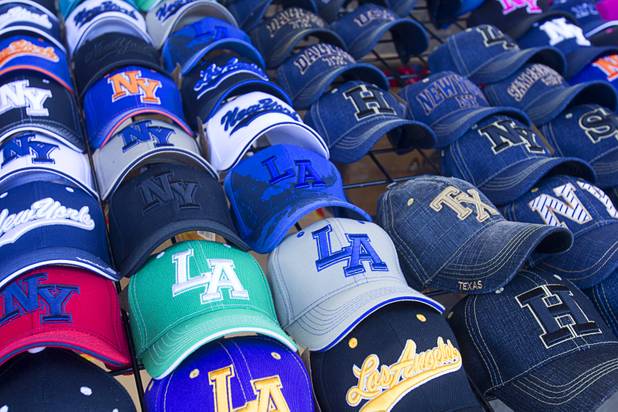 A variety of baseball caps are shown at a cap store at the Broadacres Marketplace & Events Center Sunday Nov. 3, 2013.