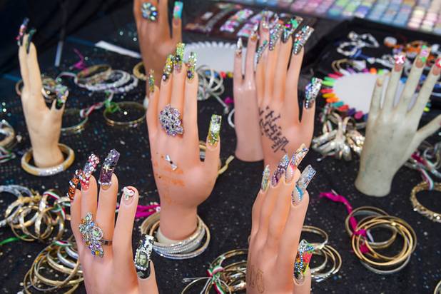 False fingernails and bracelets are displayed at the Broadacres Marketplace & Events Center Sunday Nov. 3, 2013.