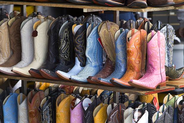 A variety of cowboy boots are shown at a vendor's booth at the Broadacres Marketplace & Events Center Sunday Nov. 3, 2013.