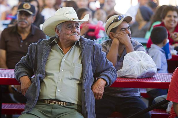 A man listens to live music by Conjunto Pena Blanca at the Broadacres Marketplace & Events Center Sunday Nov. 3, 2013.