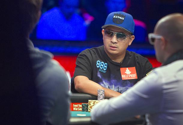 J.C. Tran, 36, a poker professional from Sacramento, Calif., competes during the final table of the World Series of Poker $10,000 buy-in no-limit Texas Hold 'Em tournament at the Rio Monday, Nov. 4, 2013. The 2013 