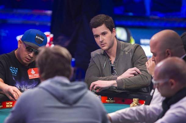 David Benefield, right, 27, a part-time student and part-time poker professional from New York City,  competes during the final table of the World Series of Poker $10,000 buy-in no-limit Texas Hold 'Em tournament at the Rio Monday, Nov. 4, 2013. The 2013 