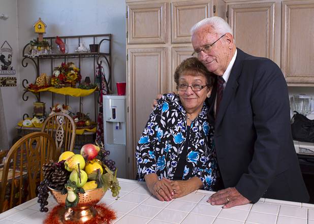 Lanny Littlefield gives a hug to his wife Gloria in their home in Henderson Tuesday, Nov. 5, 2013. The couple will leave soon for a LDS church leadership mission in Knoxville, Tenn.