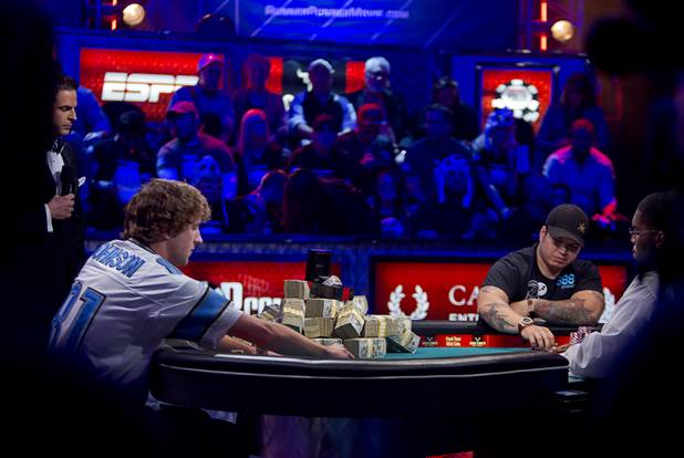 Ryan Riess, left, 23, a poker professional from East Lansing, Mich. and Jay Farber, 29, a Las Vegas VIP Host originally from Santa Barbara, Calif., play head to head during the final table of the World Series of Poker $10,000 buy-in no-limit Texas Hold 'Em tournament at the Rio Monday, Nov. 4, 2013.