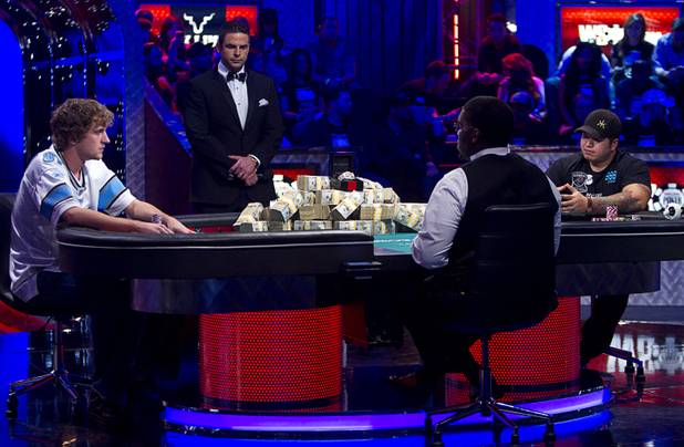 Ryan Riess, left, 23, a poker professional from East Lansing, Mich. and Jay Farber, 29, a Las Vegas VIP Host originally from Santa Barbara, Calif., compete during the final table of the World Series of Poker $10,000 buy-in no-limit Texas Hold 'Em tournament at the Rio Monday, Nov. 4, 2013.