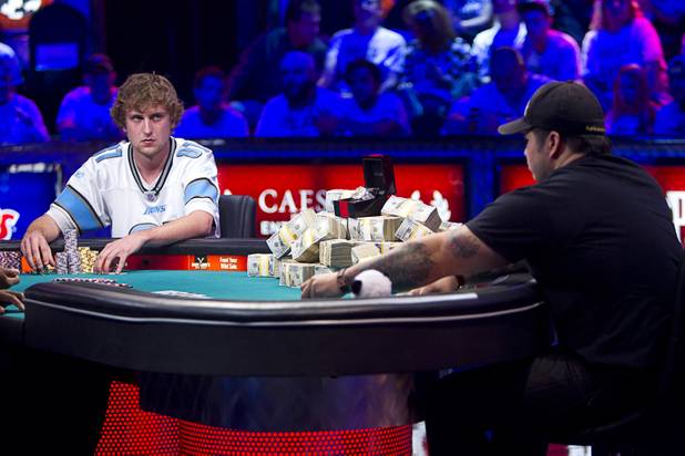 Ryan Riess, left, 23, a poker professional from East Lansing, Mich. plays against Jay Farber, 29, a Las Vegas VIP Host originally from Santa Barbara, Calif., during the final table of the World Series of Poker $10,000 buy-in no-limit Texas Hold 'Em tournament at the Rio Monday, Nov. 4, 2013.