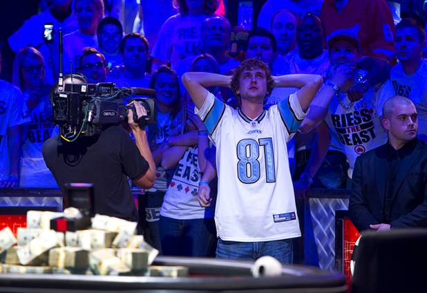 Ryan Riess, 23, a poker professional from East Lansing, Mich., waits for a turn card after Jay Farber goes all-in during the final table of the World Series of Poker $10,000 buy-in no-limit Texas Hold 'Em tournament at the Rio Tuesday, Nov. 5, 2013. Farber survived and doubled up on chips. 