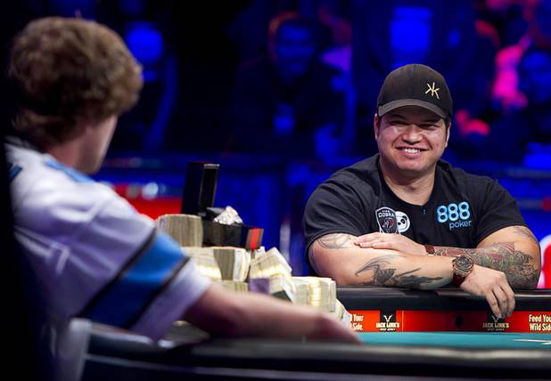 Jay Farber, right, 29, a Las Vegas VIP host originally from Santa Barbara, Calif., smiles after folding a hand against Ryan Riess, 23, a poker professional from East Lansing, Mich., during the final table of the World Series of Poker $10,000 buy-in no-limit Texas Hold 'Em tournament at the Rio on Tuesday, Nov. 5, 2013. 