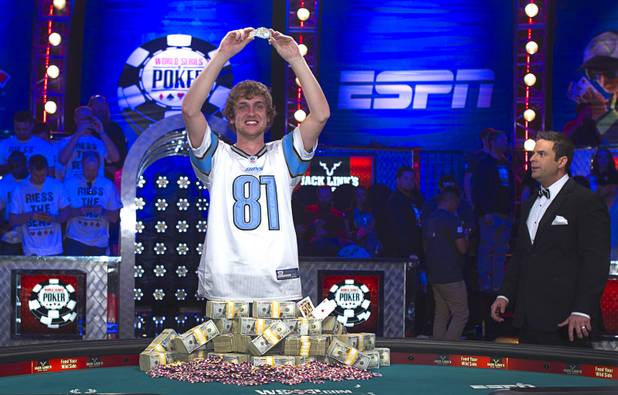 Ryan Riess, 23, a poker professional from East Lansing, Mich., poses with his championship bracelet after winning the World Series of Poker $10,000 buy-in no-limit Texas Hold 'Em tournament at the Rio Tuesday, Nov. 5, 2013. 