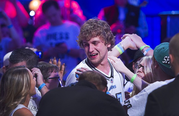 Ryan Riess, 23, a poker professional from East Lansing, Mich., celebrates with family and friends after winning the World Series of Poker $10,000 buy-in no-limit Texas Hold 'Em tournament at the Rio Tuesday, Nov. 5, 2013.
