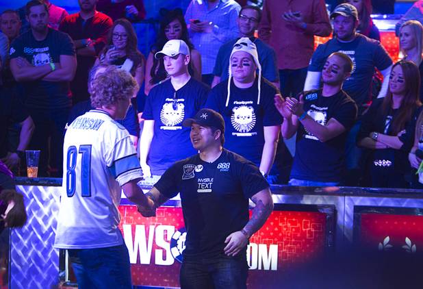 Ryan Riess, left, 23, a poker professional from East Lansing, Mich., shakes hands with second place finisher Jay Farber, 29, a Las Vegas VIP Host originally from Santa Barbara, Calif., after Riess won the World Series of Poker $10,000 buy-in no-limit Texas Hold 'Em tournament at the Rio Tuesday, Nov. 5, 2013. Riess takes home $8,359,531 in prize money for first place.