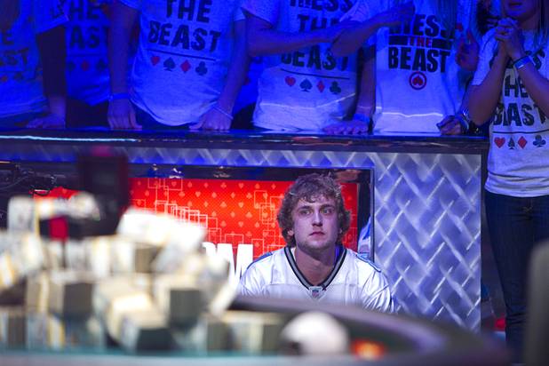 Ryan Riess, 23, a poker professional from East Lansing, Mich., waits for his final cards before winning the World Series of Poker $10,000 buy-in no-limit Texas Hold 'Em tournament at the Rio Tuesday, Nov. 5, 2013.