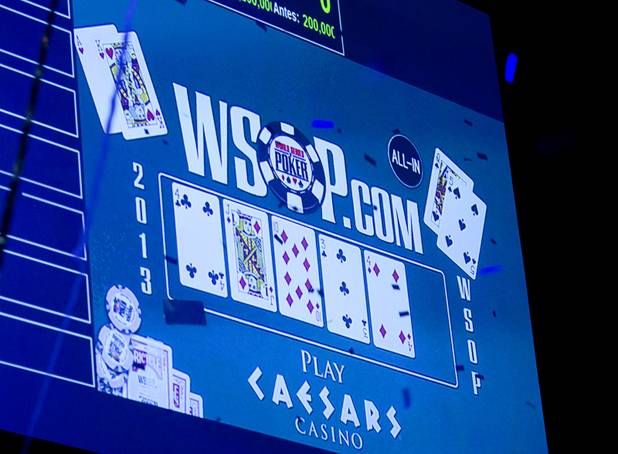 The final cards are displayed on a video monitor during the World Series of Poker $10,000 buy-in no-limit Texas Hold 'Em tournament at the Rio Tuesday, Nov. 5, 2013.