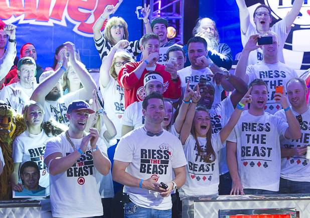 Supporters of Ryan Riess, 23, a poker professional from East Lansing, Mich., celebrate after Riess won the World Series of Poker $10,000 buy-in no-limit Texas Hold 'Em tournament at the Rio Tuesday, Nov. 5, 2013.