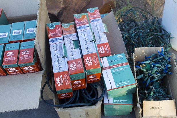 Boxes of LED holiday lights are shown as Steve Bowdoin, caretaker of Ethel M Chocolate factory's Botanical Cactus Garden, strings lights at the garden Wednesday, Nov. 6, 2013. The 20th annual holiday lighting display will kick off with a ceremony on Tuesday, Nov. 12.