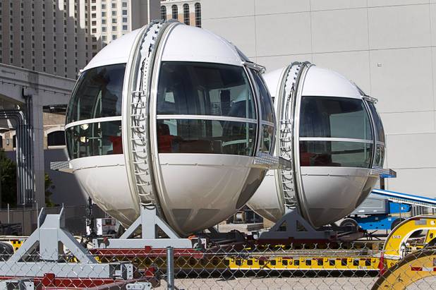 Cabins are shown next to the 550-foot tall High Roller, the world's tallest observation wheel, under construction near the Las Vegas Strip and Flamingo Road Thursday, Nov. 7, 2013. The wheel is the centerpiece of the Linq project, a $550 million outdoor retail, dining and entertainment district being developed by Caesars Entertainment Corp. The High Roller will feature 28 cabins that will each hold 40 passengers. The first cabin was attached early Wednesday.